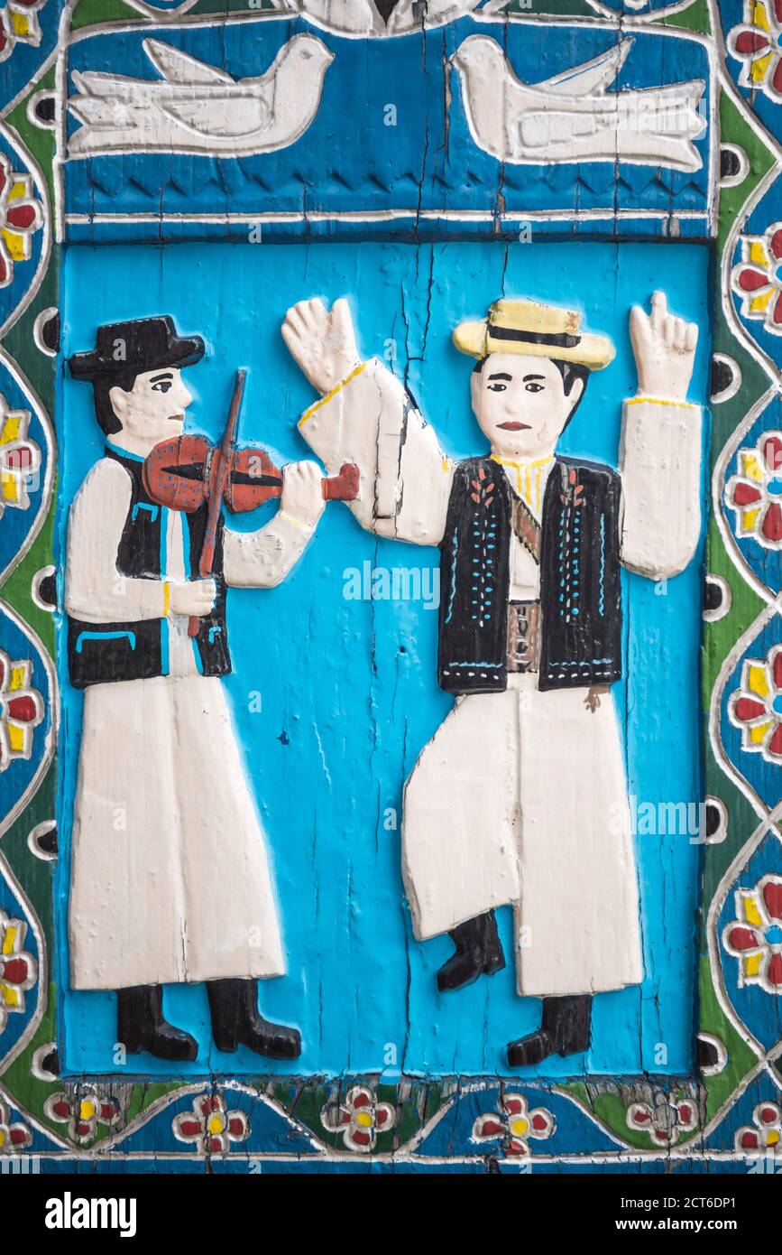 Colourful carving on a wooden tombstone in the Merry Cemetery, Sapanta, Maramures, Romania Stock Photo