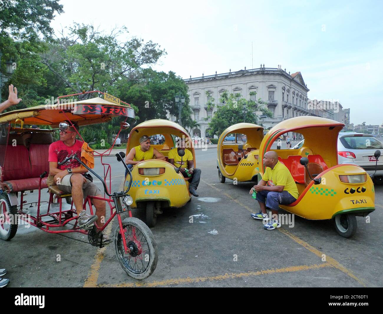 THREE COCO TAXI AND A PEDAL RICKSHAW WAITING FOR TOURISTS TO BE ...