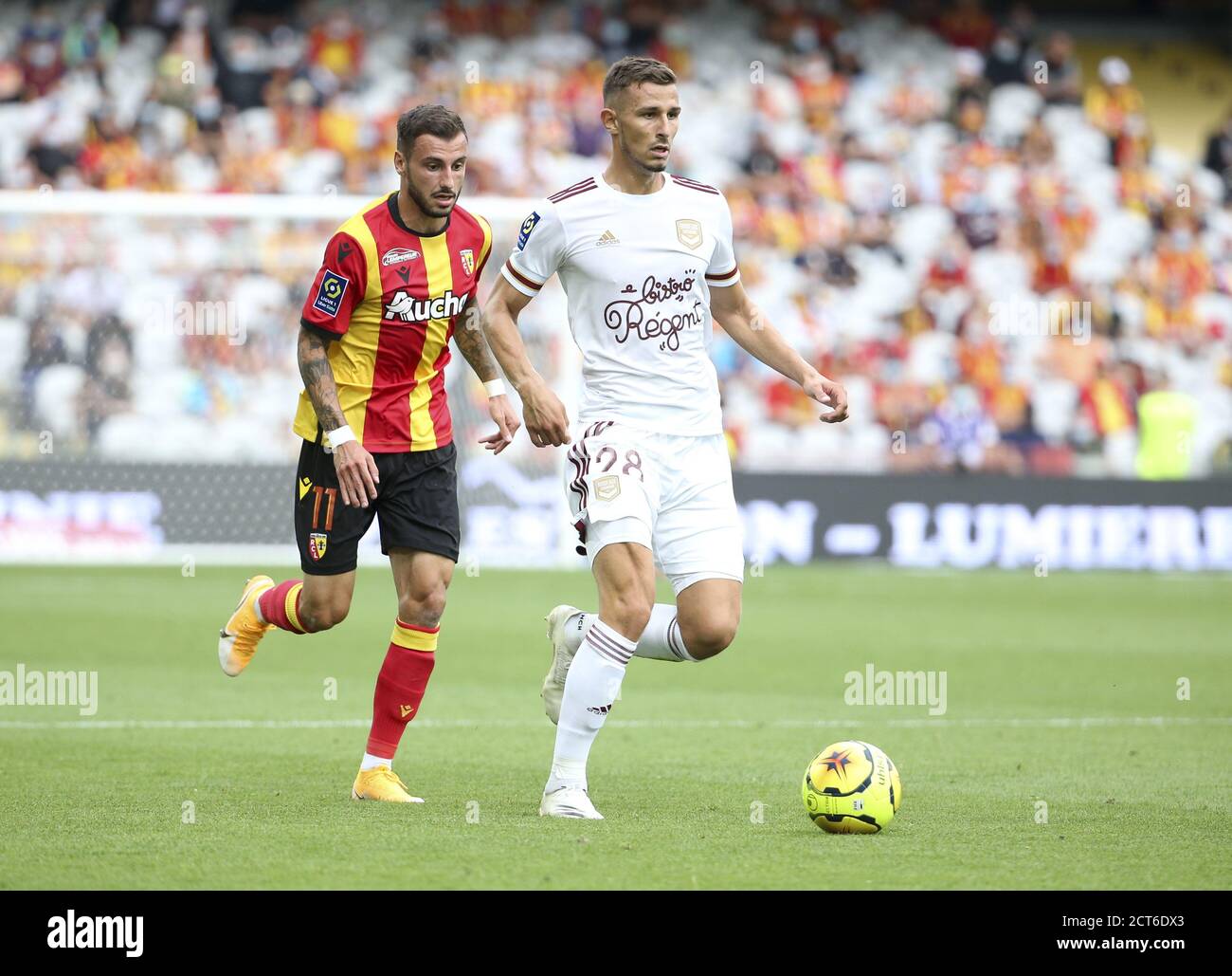 Remi Oudin of Bordeaux, Jonathan Clauss of Lens (left) during the French championship Ligue 1 football match between RC Lens and Girondins de Bordeaux Stock Photo