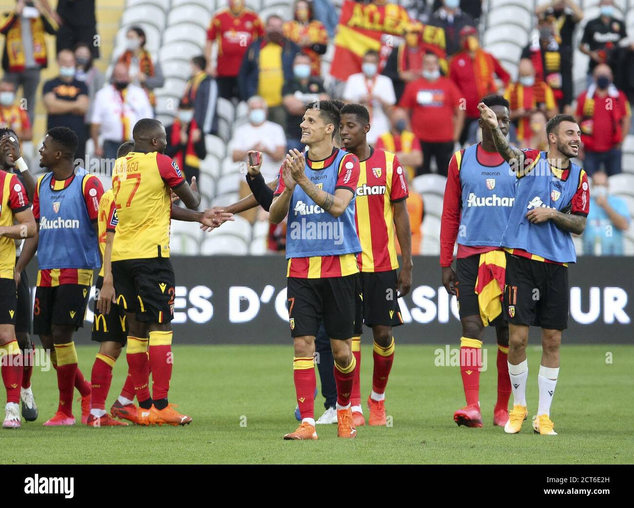 Players of Lens celebrate the victory following the French championship Ligue 1 football match between RC Lens and Girondins de Bordeaux on September Stock Photo