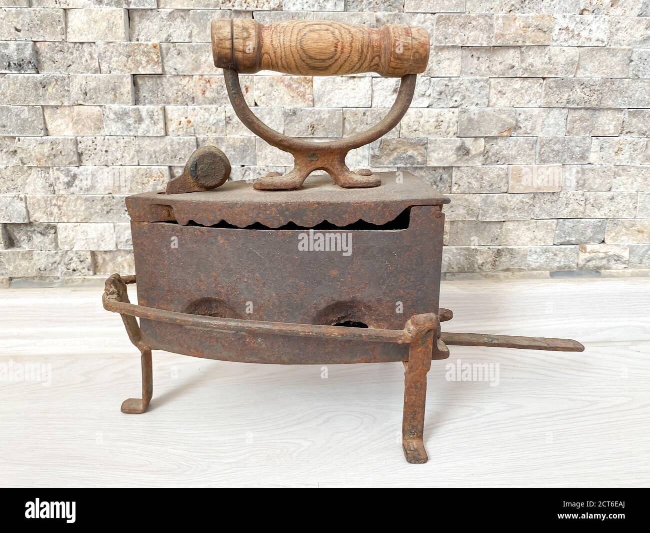 Old vintage iron. Old iron, heated by hot coals. Stock Photo