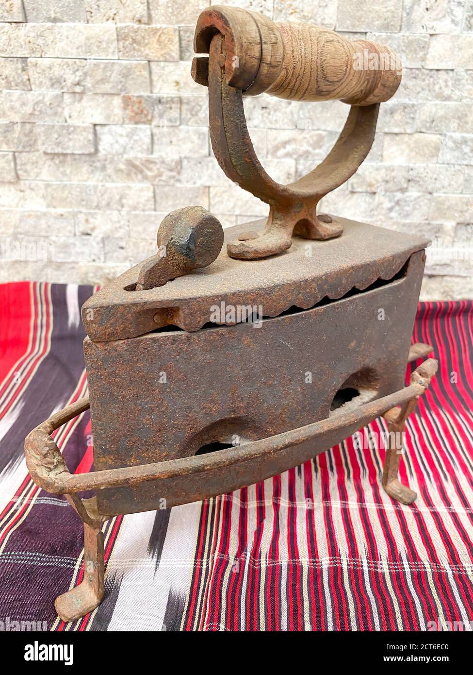 Old vintage iron. Old iron, heated by hot coals. Stock Photo