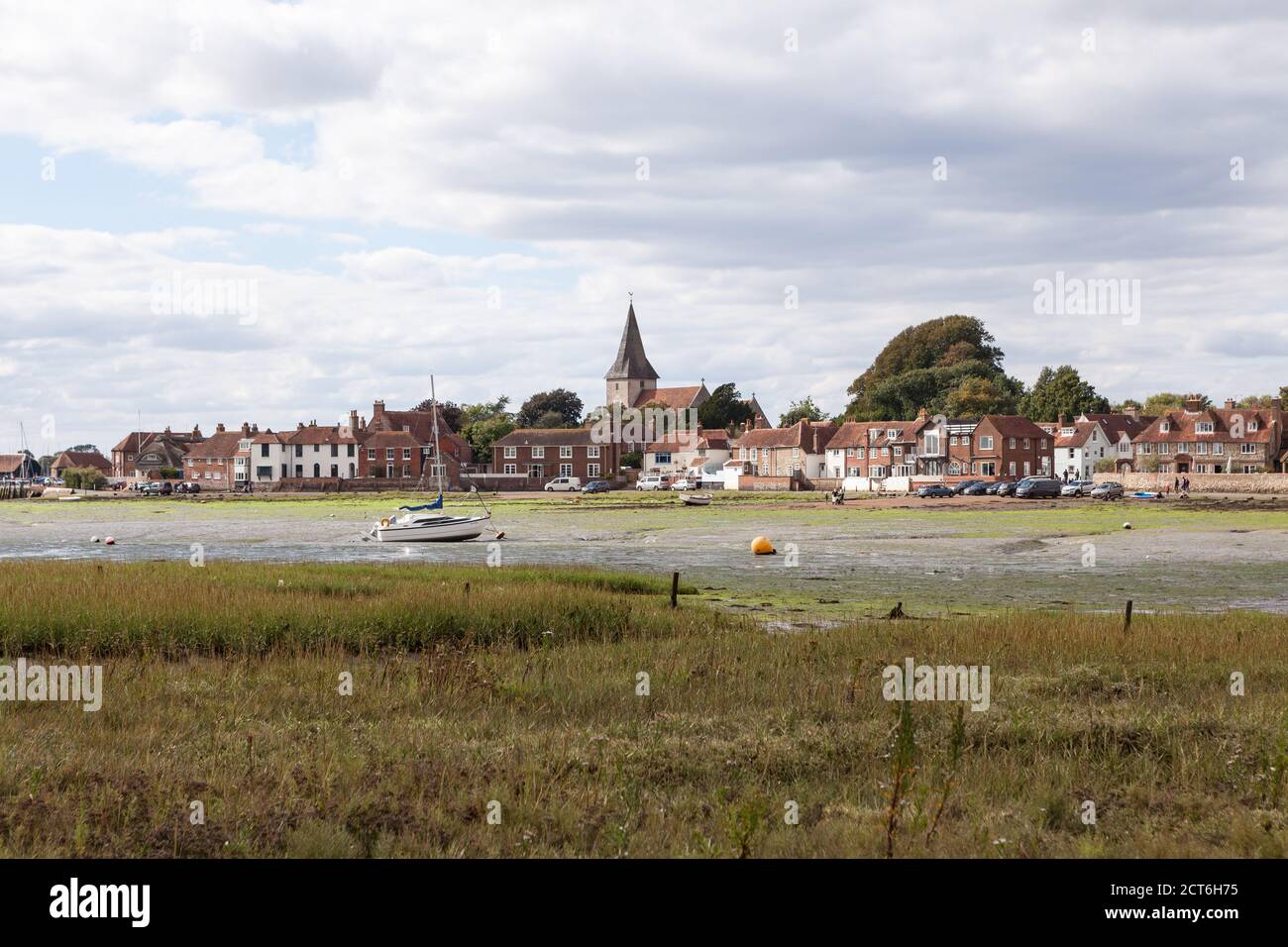 Bosham, a village in West Sussex, as seen from across the creek at low tide. Stock Photo