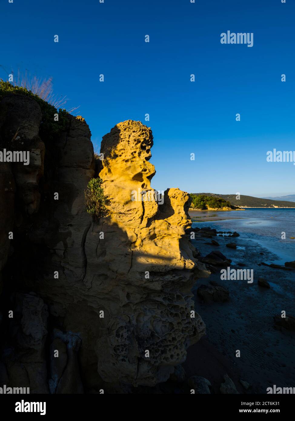 Warm warmth sunset late afternoon light tertiary rocky rock boulder marls and sandstones of the Lopar peninsula on Rab island Croatia Europe Stock Photo