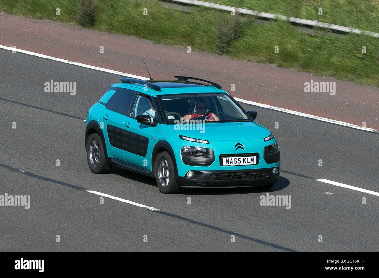 A 2015 Citroen C4 Cactus Feel Puretech Blue Car Hatchback Petrol driving on  the M6 motorway near Preston in Lancashire, UK Stock Photo - Alamy