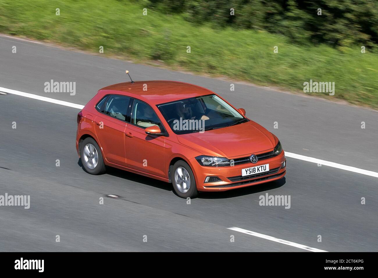 2018 Volkswagen VW Polo Se Tsi Orange Car Hatchback Petrol driving on the M6 motorway near Preston in Lancashire, UK. Stock Photo