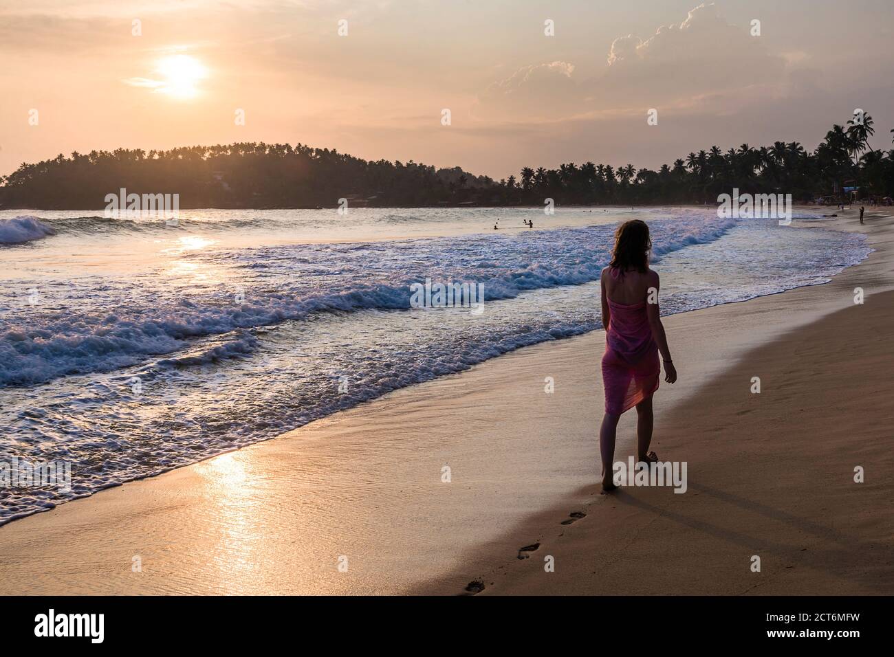 Mirissa Beach, tourist on Mirissa Beach at sunset, South Coast of Sri Lanka, Southern Province, Asia Stock Photo