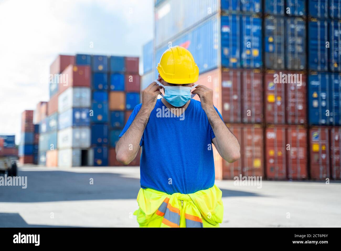 Cargo Container Maskcot Container worker wearing protective mask to Protect Against Covid-19 ...