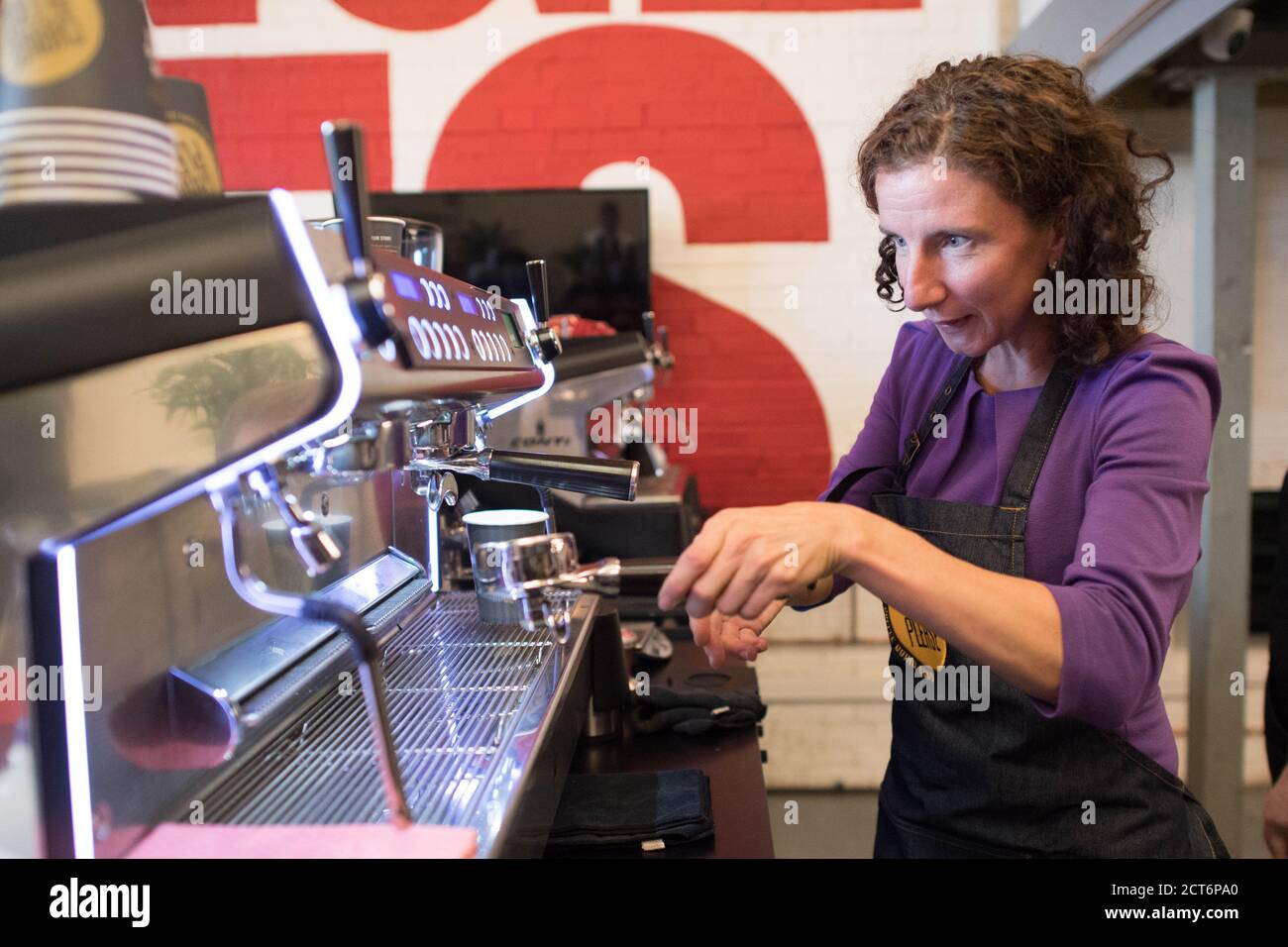 Shadow Chancellor Anneliese Dodds learns how to make coffee during a
