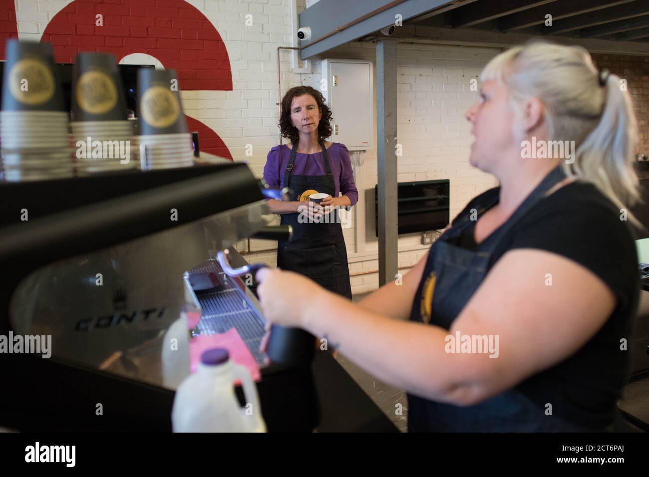 Shadow Chancellor Anneliese Dodds learns how to make coffee during a