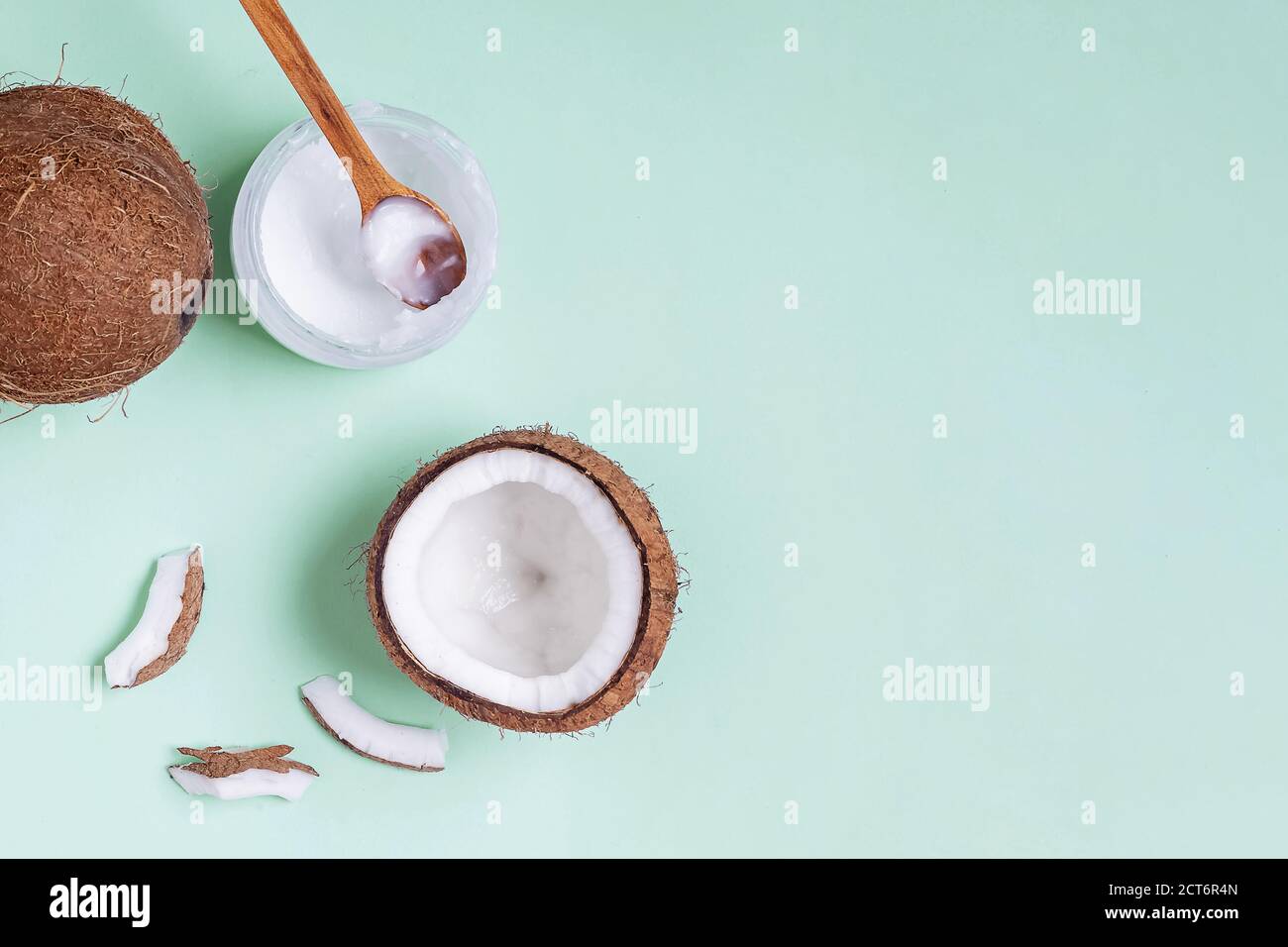 Coconuts on blue background, top view. Stock Photo