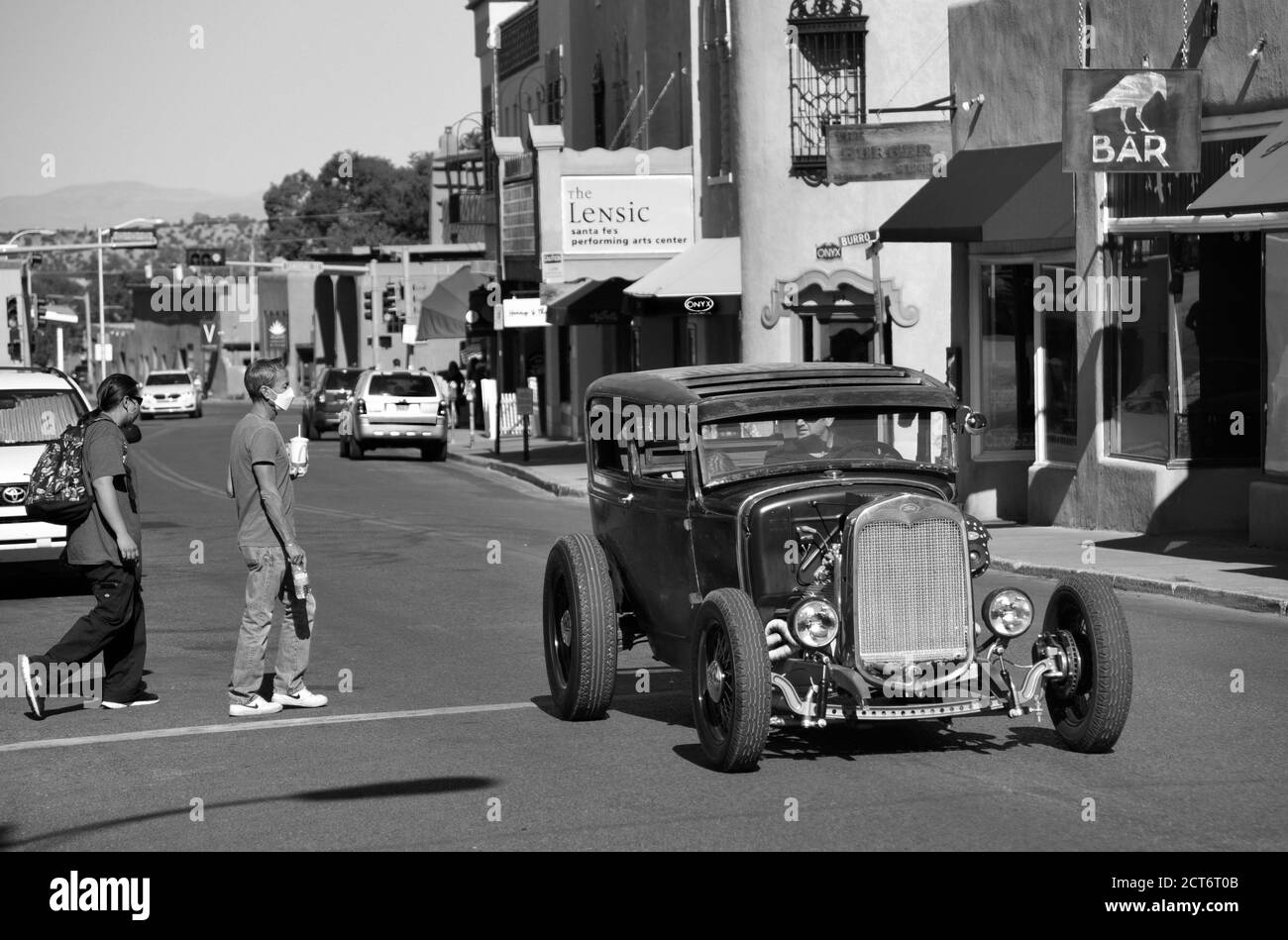 A man cruises the streets of Santa Fe, New Mexico, in his 'rat rod.' Stock Photo