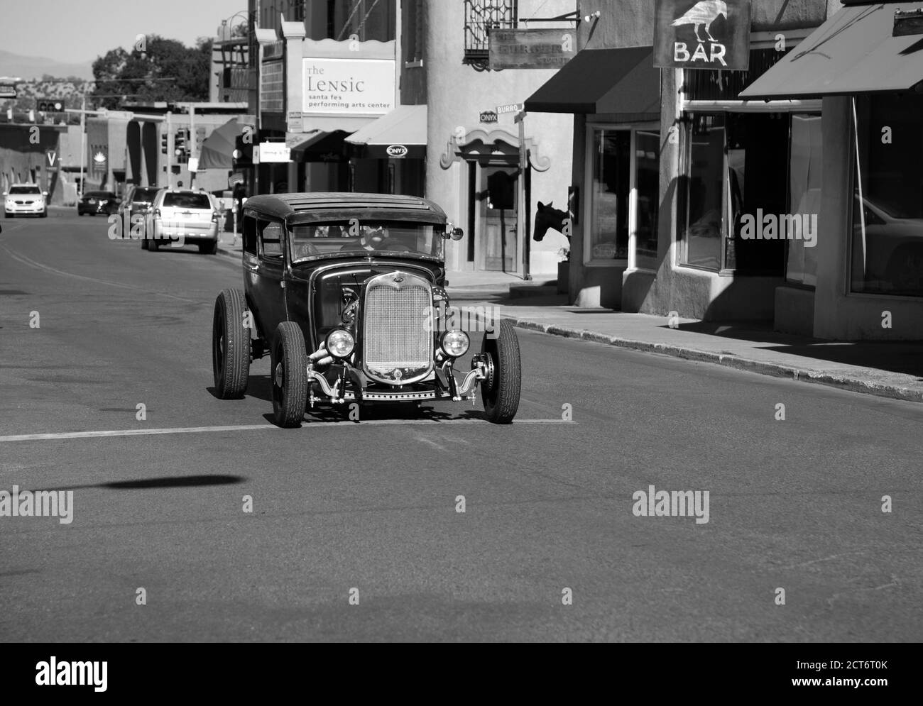 A man cruises the streets of Santa Fe, New Mexico, in his 'rat rod.' Stock Photo