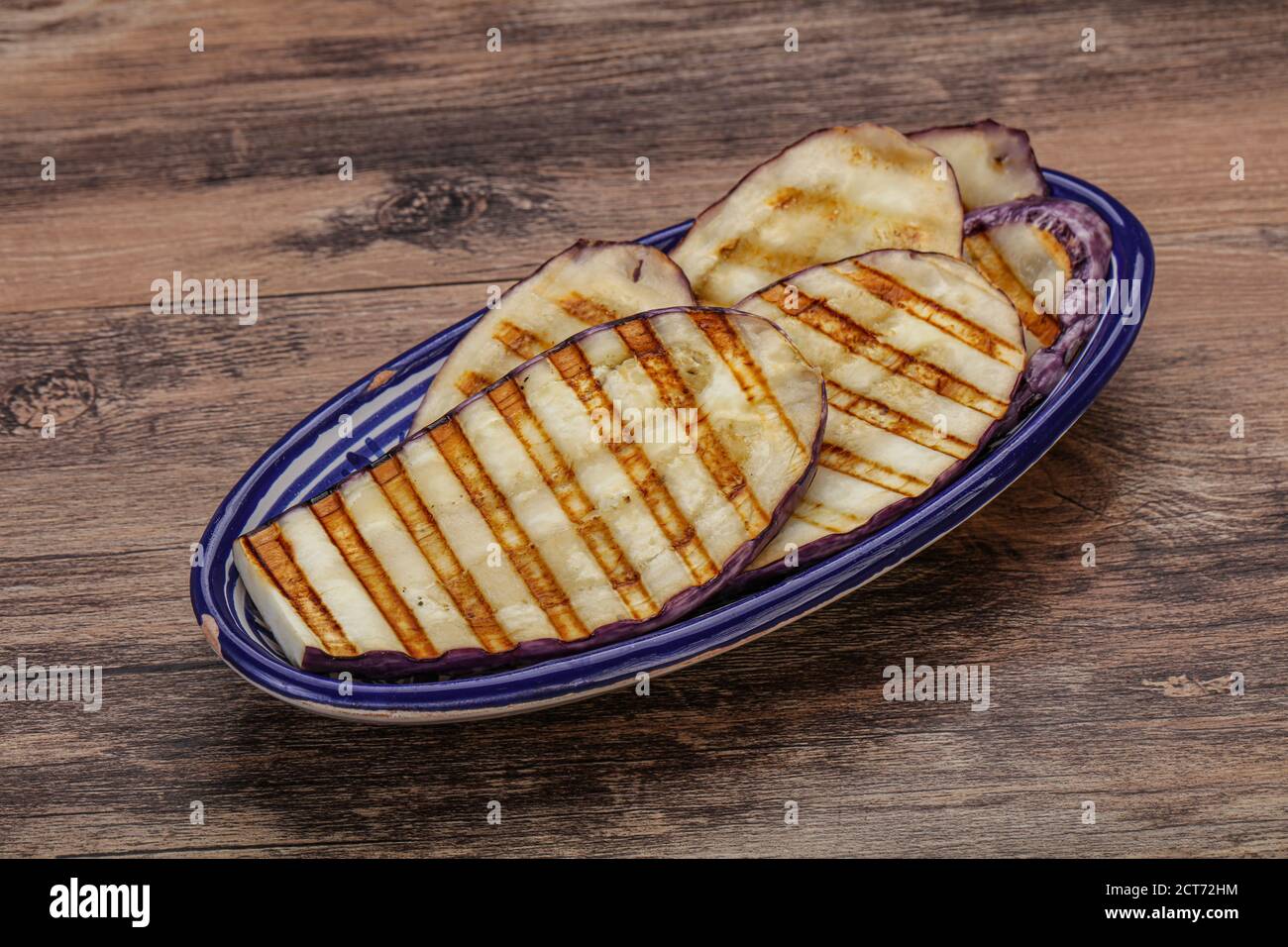 Grilled graffiti eggpant slices with olive oil Stock Photo Alamy