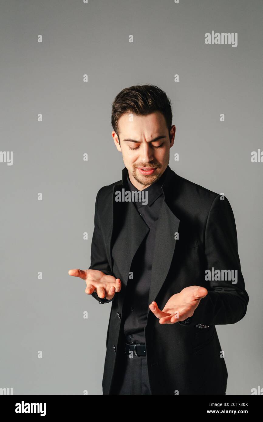 Serious man in suit explaining hi-res stock photography and images - Alamy