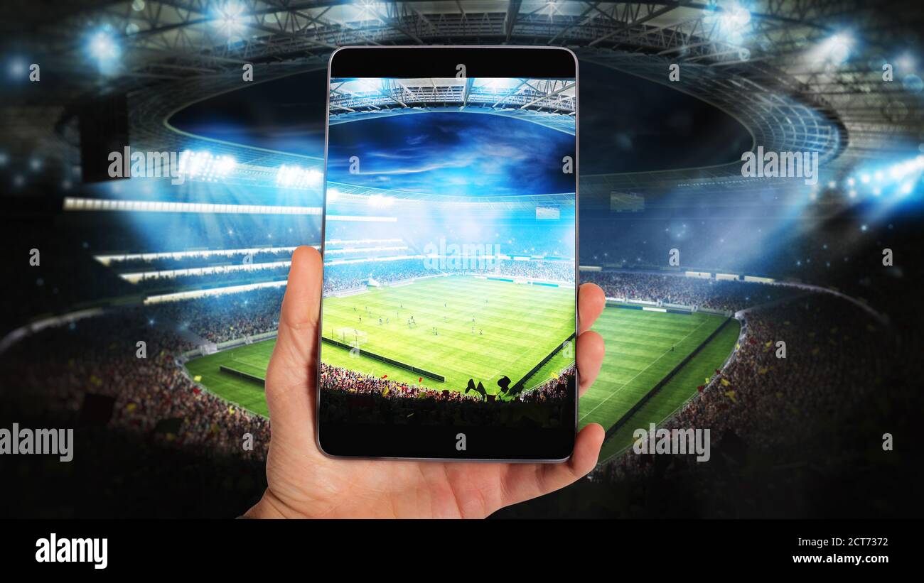 Watch a live sports event on your mobile Stock Photo