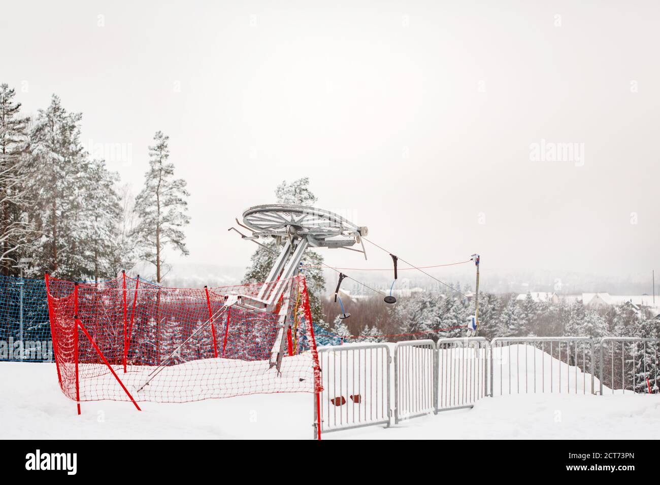 Winter landscape with yoke ski lifts in snowy forest Stock Photo