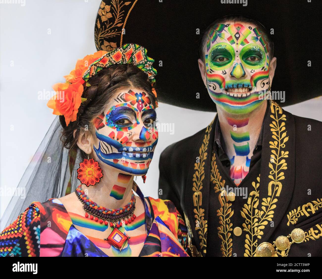 Two Mexican Day of the Dead performers in painted faces and outfits, World Travel Market (WTM) trade show, ExCel London, UK Stock Photo