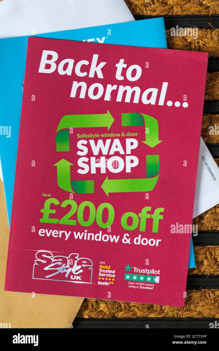 unsolicited mail junk mail on doormat - back to normal Safestyle window & door swap shop Stock Photo