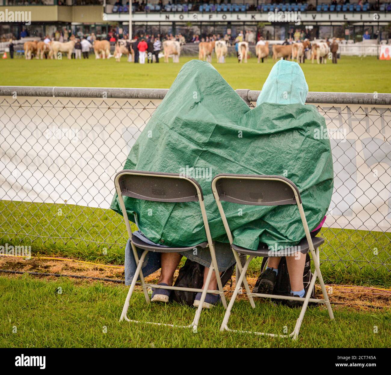 Visitors sheltering from the rain at the South of England Show Stock Photo