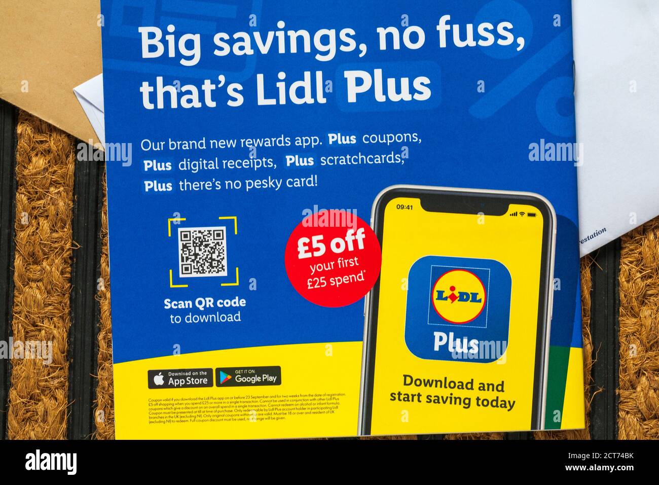 unsolicited mail junk mail on doormat - Lidl booklet big savings no fuss that's Lidl plus Stock Photo