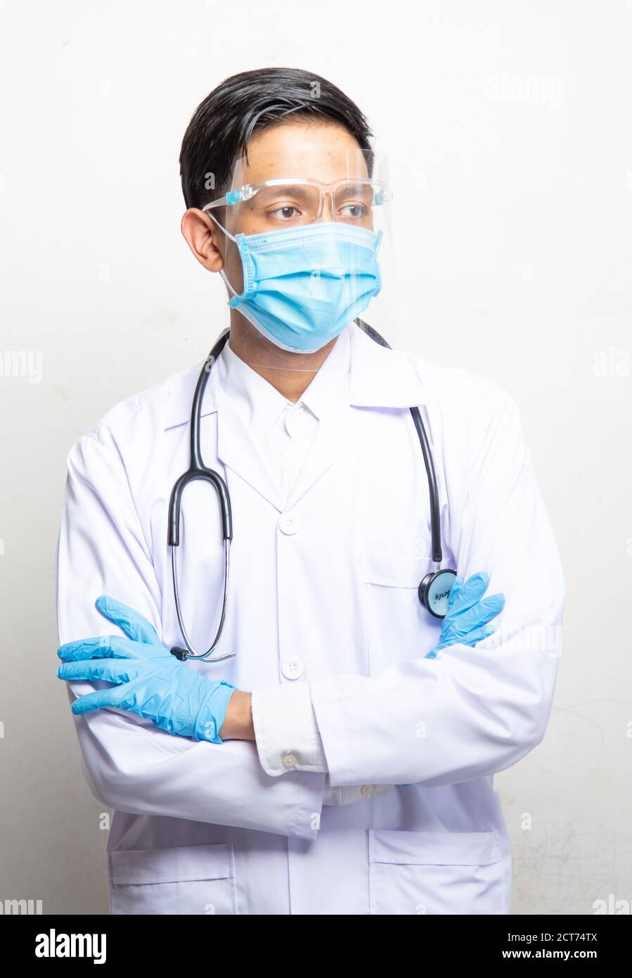Doctor Man on blur hospital laboratory panoramic blue background. COVID-19 virus epidemic outbreak to Coronavirus pandemic disease global recession wi Stock Photo