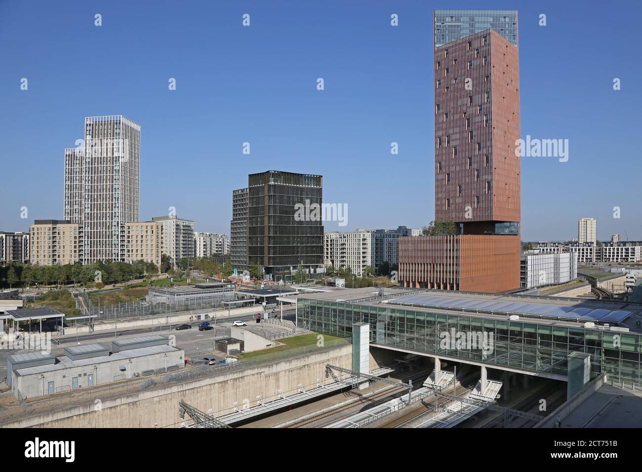 High level view of Stratford International railway station in east London, UK. Shows the Manhattan Loft Gardens tower beyond (right) by SOM Architects Stock Photo