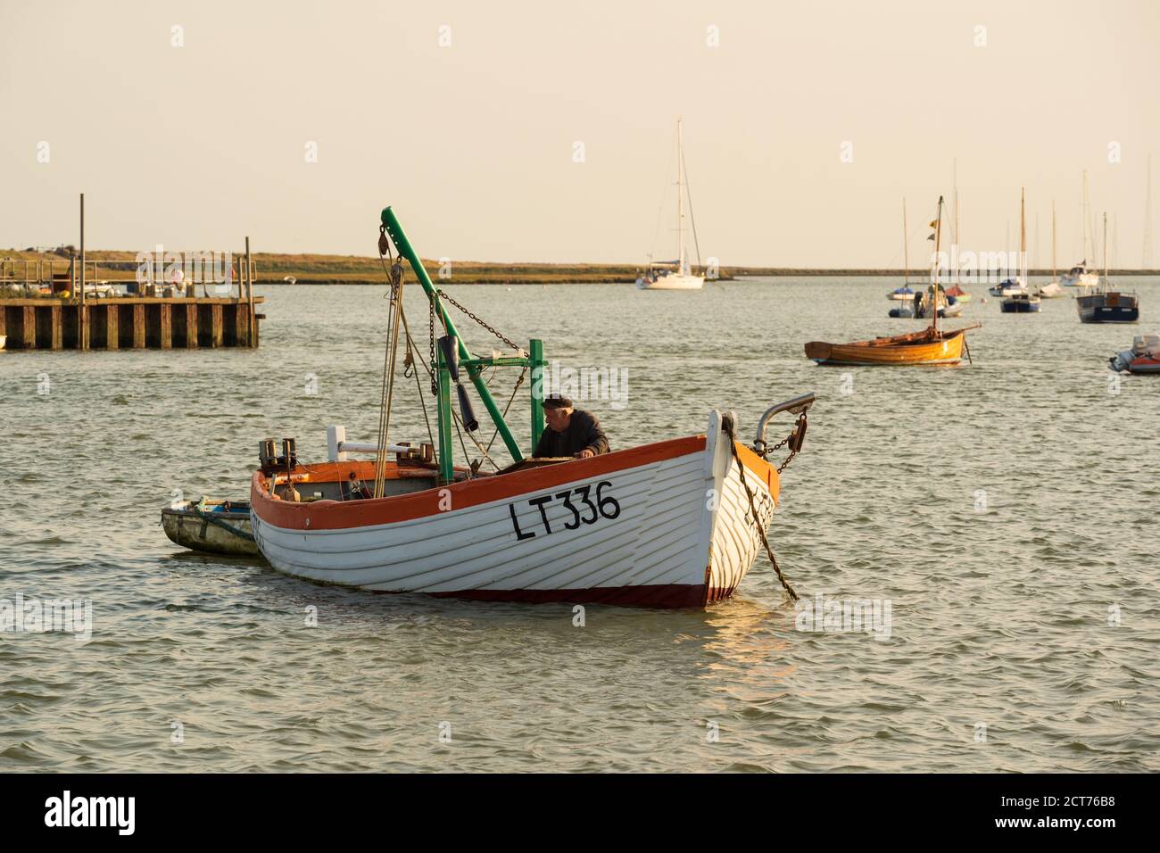 Slaughden, Aldeburgh, Suffolk. UK.  2020. Moored fishing boat on River Alde in the evening. Stock Photo