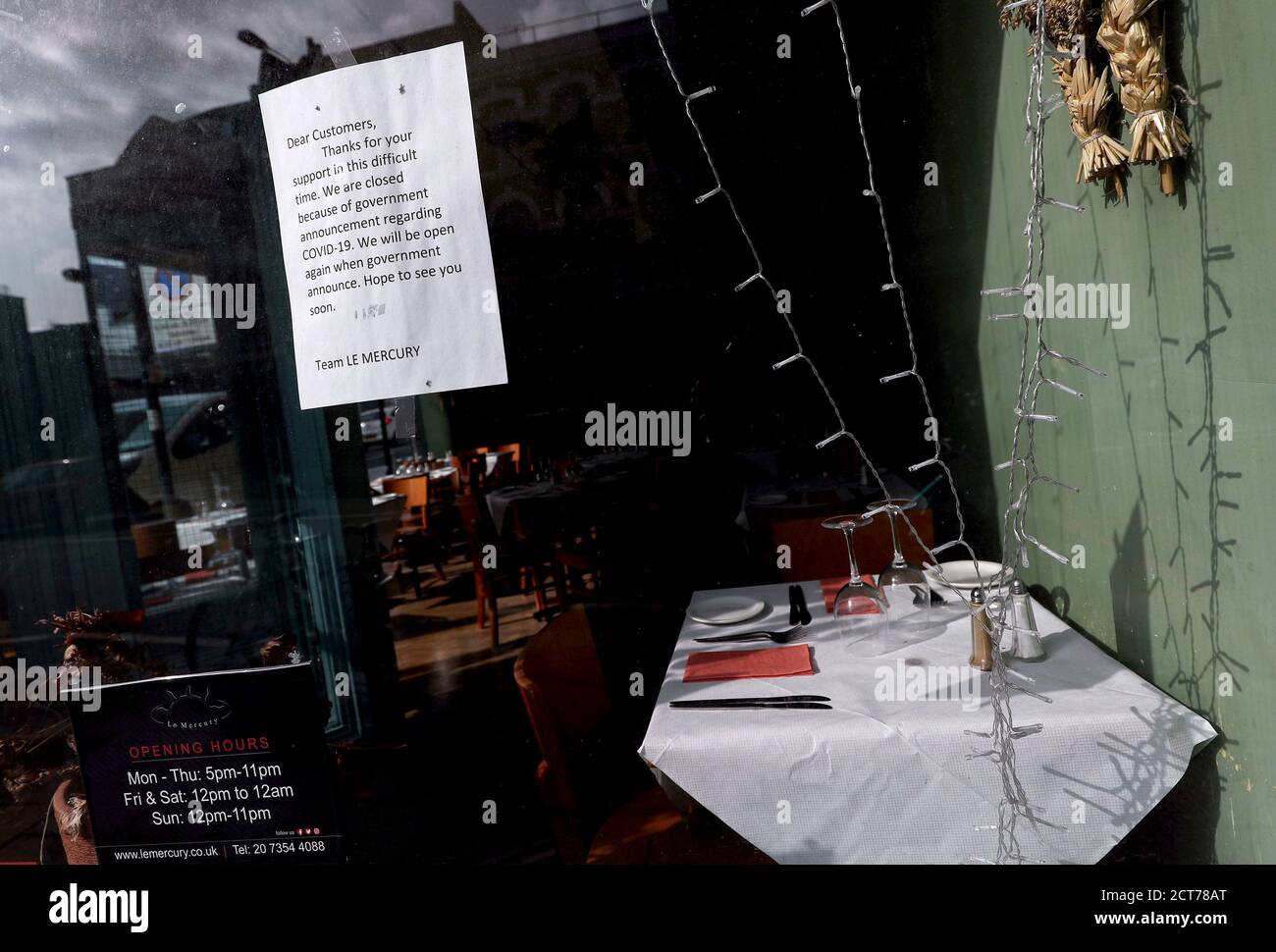A closed sign on the window of Le Mercury restaurant on Upper Street in Islington, North London. Stock Photo