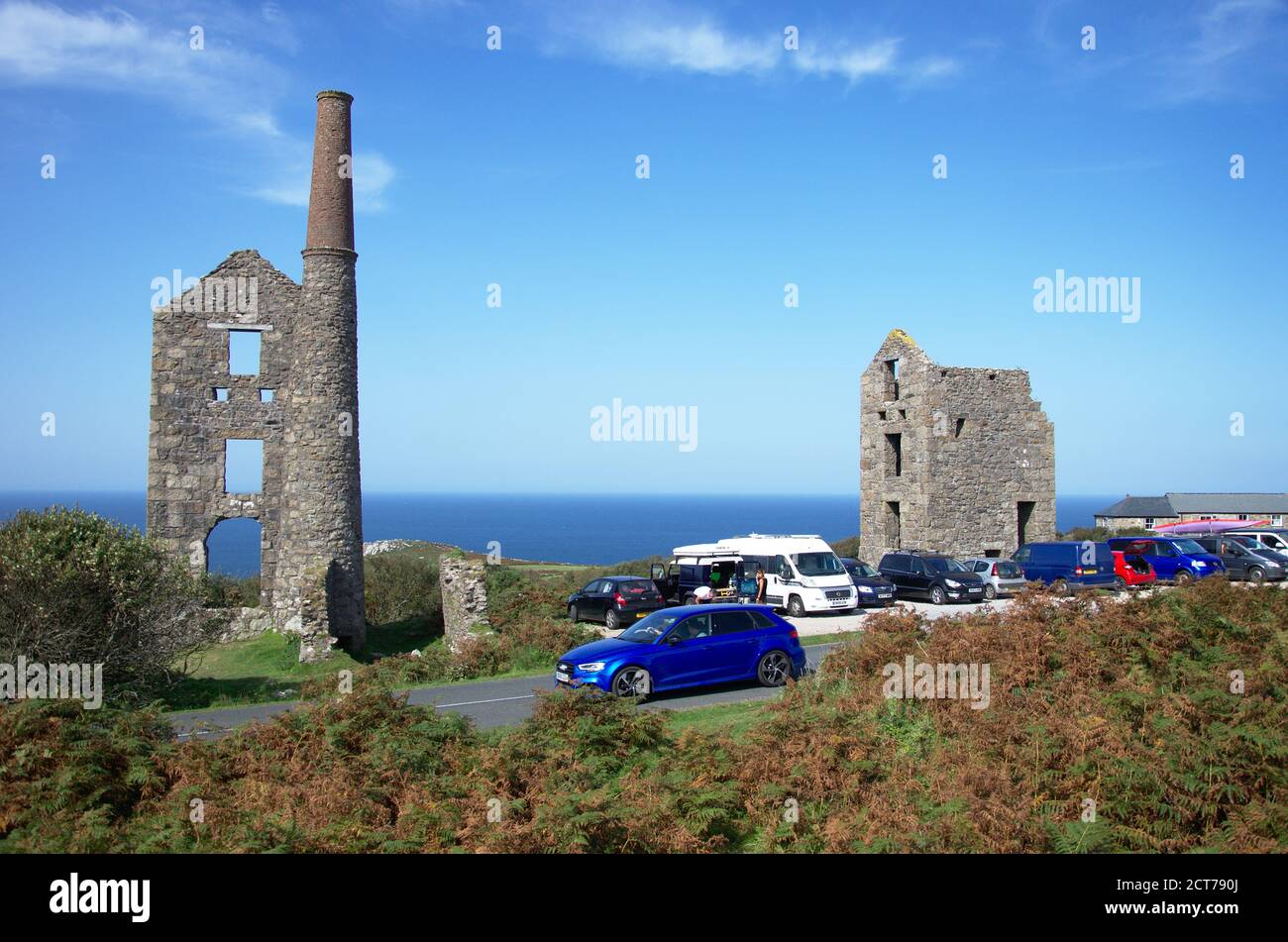 Cars parked visiting Carn Galver Mine in Cornwall on the road between St Ives and St Just Stock Photo