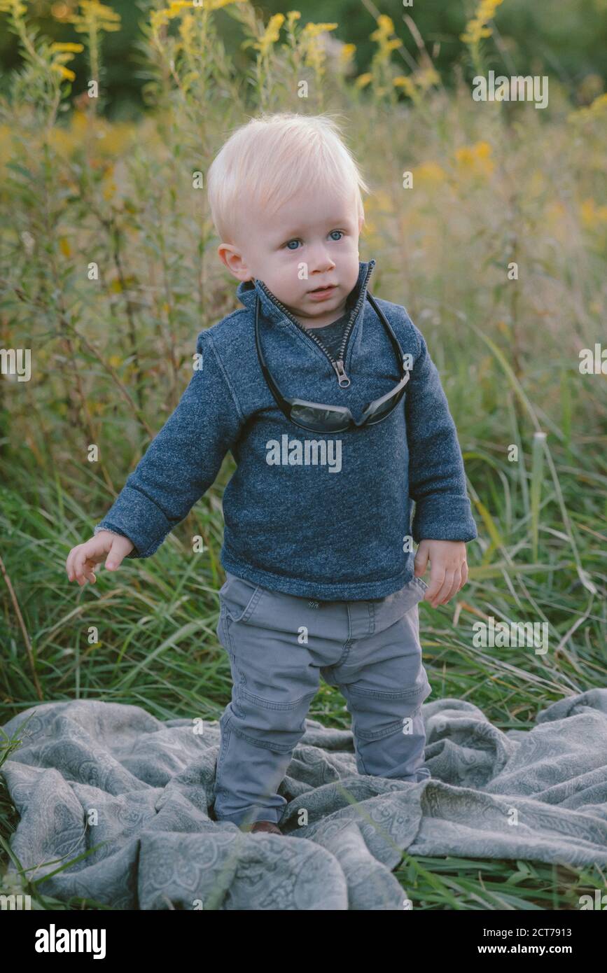 1 year old boy outdoors Stock Photo