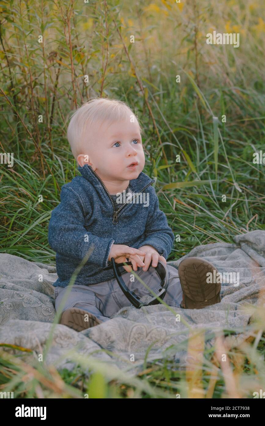 1 year old boy outdoors Stock Photo