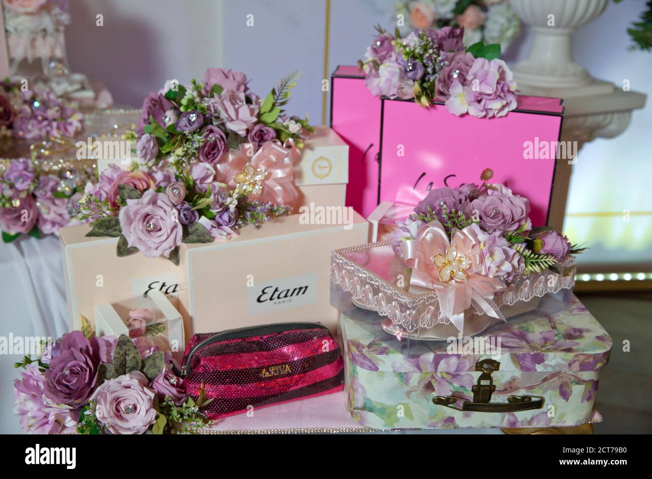 Engagement basket . Rose suitcase . Red women's bag . gift box . Basket  with sweets stands on the table . Engagement accessories Stock Photo - Alamy