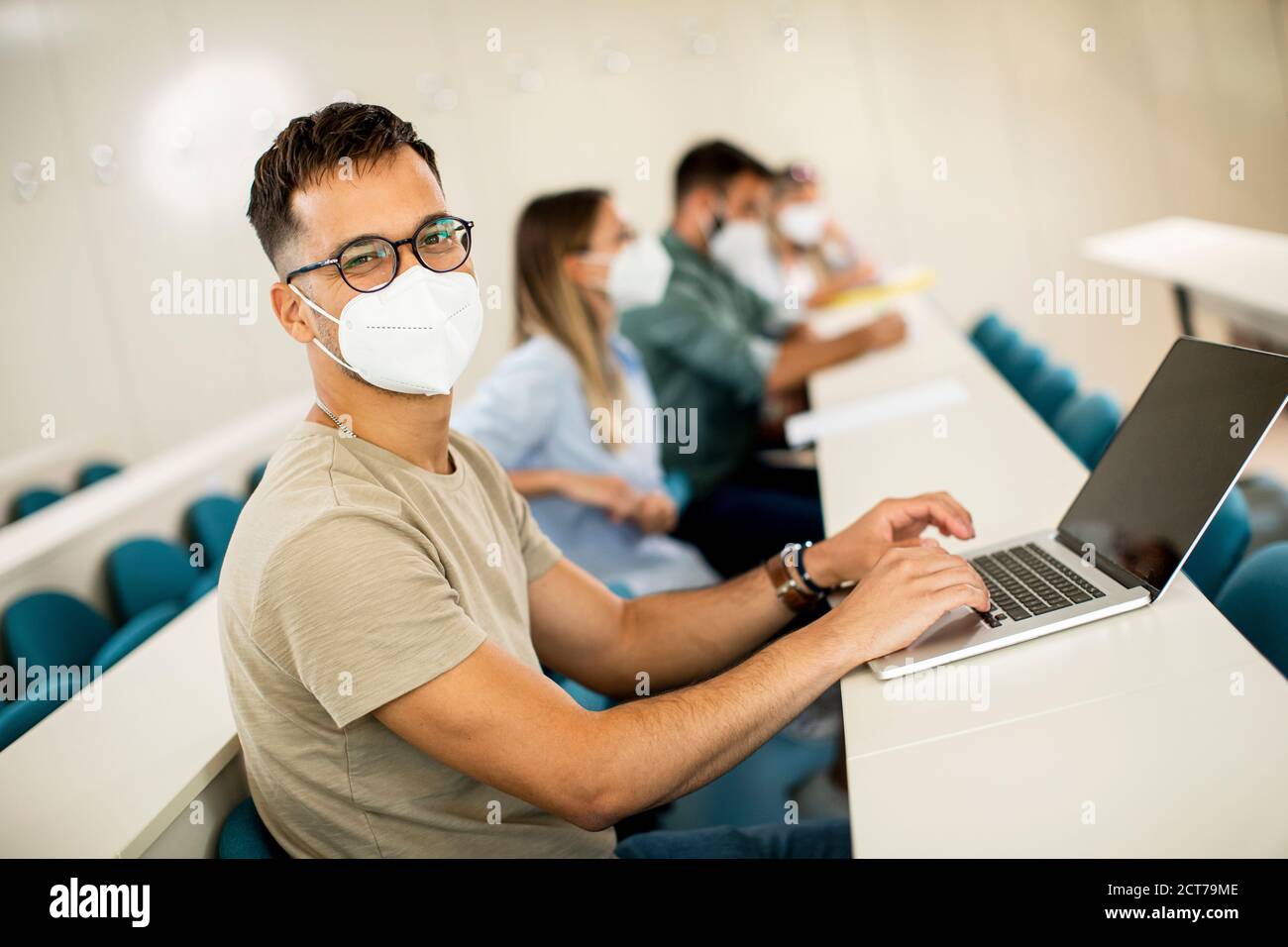 Young male student wearing face protective medical mask for virus ...