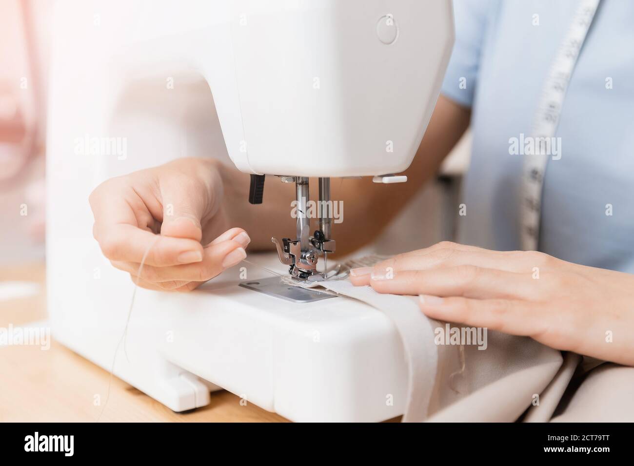 Woman needle threading studio hi-res stock photography and images - Alamy