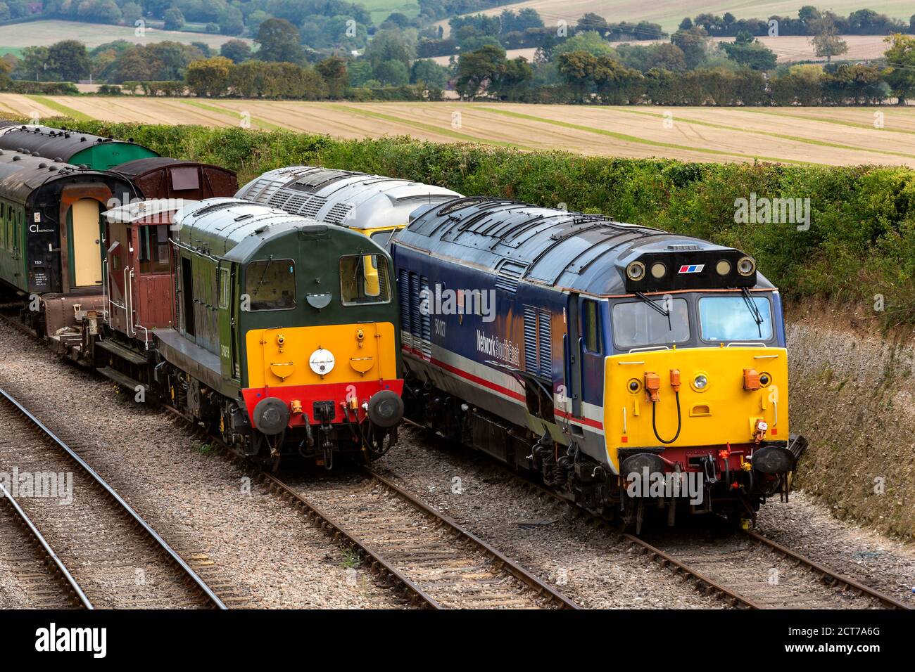 Collection of Vintage Diesel Trains in Sidings with assorted rolling stock. Stock Photo