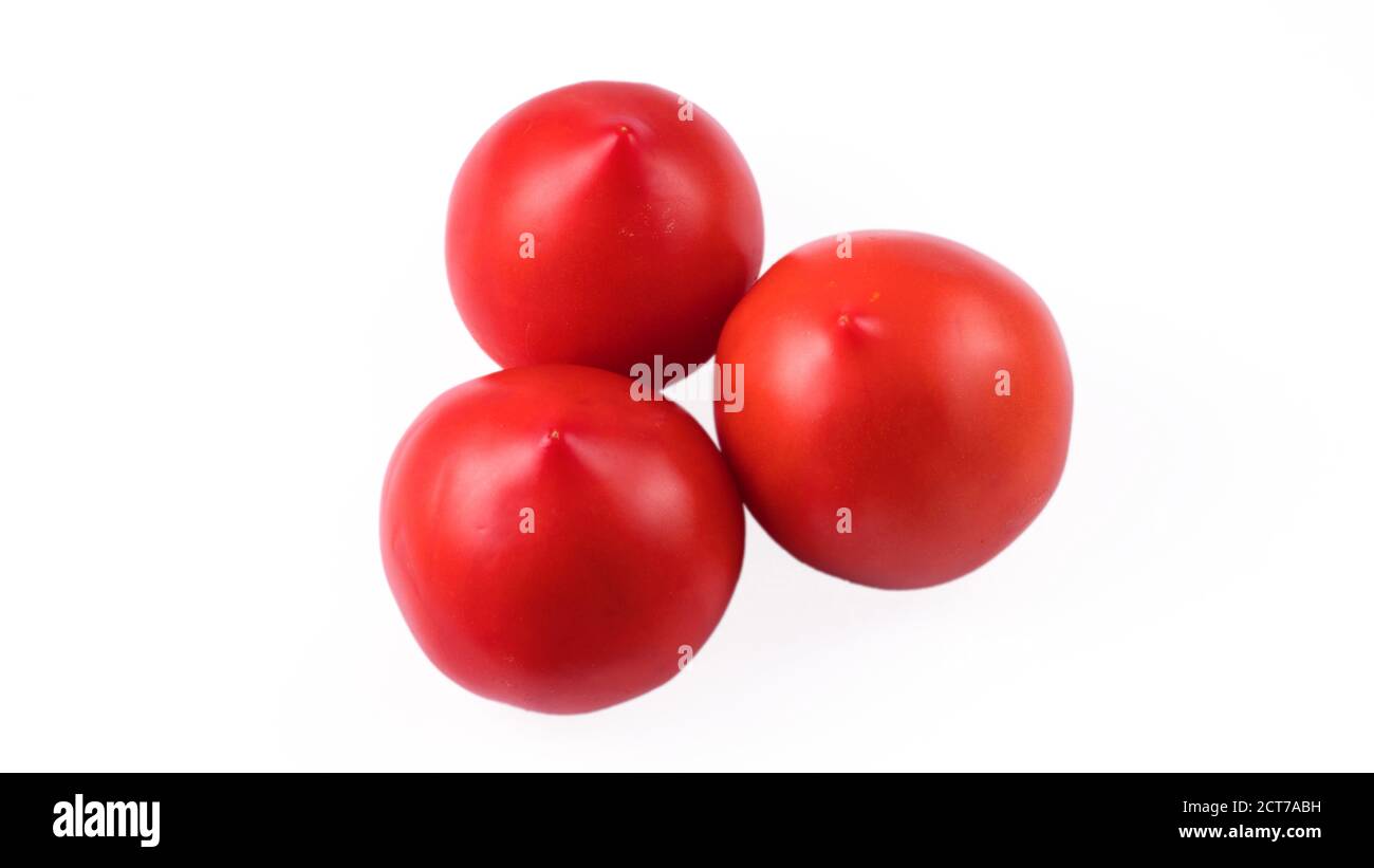 Three whole red tomatoes on a white background in isolation Stock Photo ...
