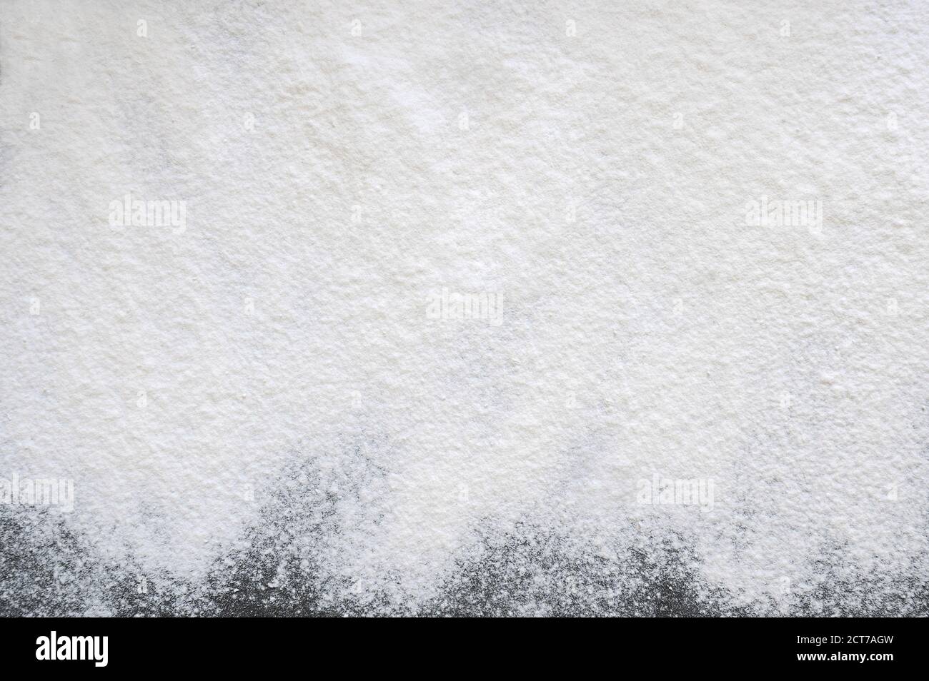 Wheat flour over gray background. Bakery. Food background. Horizontal orientation. Stock Photo