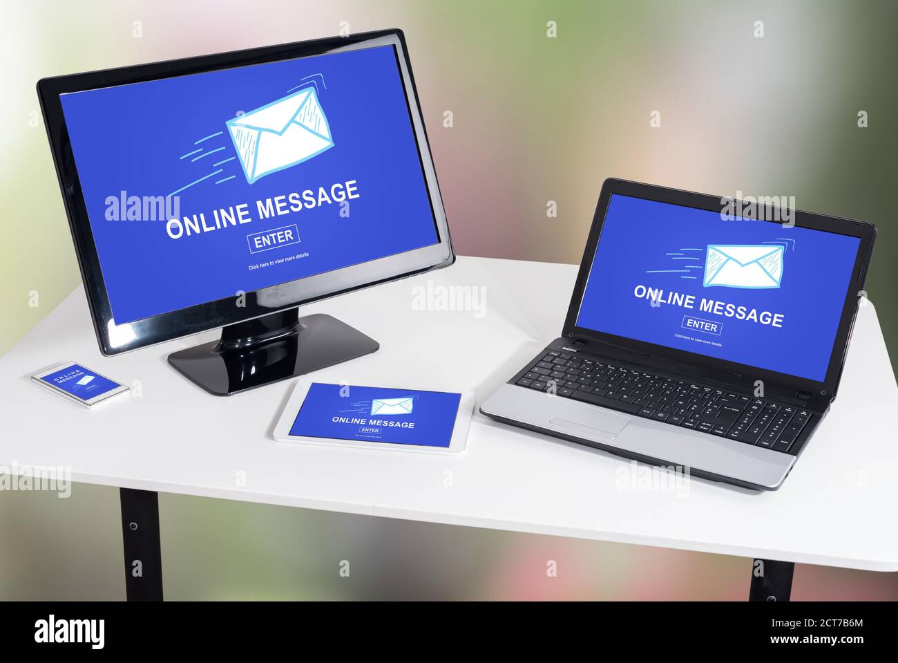 Online message concept shown on different information technology devices Stock Photo