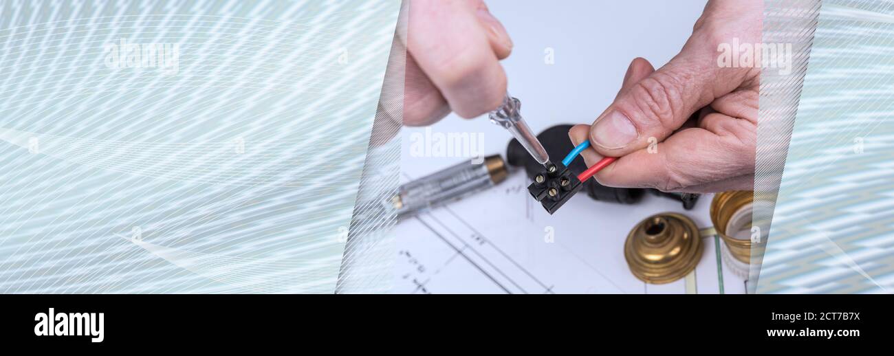Clamping a wire in a connector; panoramic banner Stock Photo