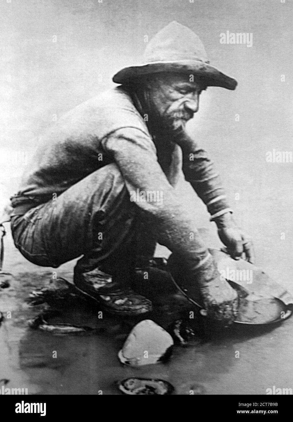 California Gold Rush. Gold prospector panning for gold in 1850 during the California Gold Rush (1848–1855), which began in January 1848 in Coloma, California. Stock Photo