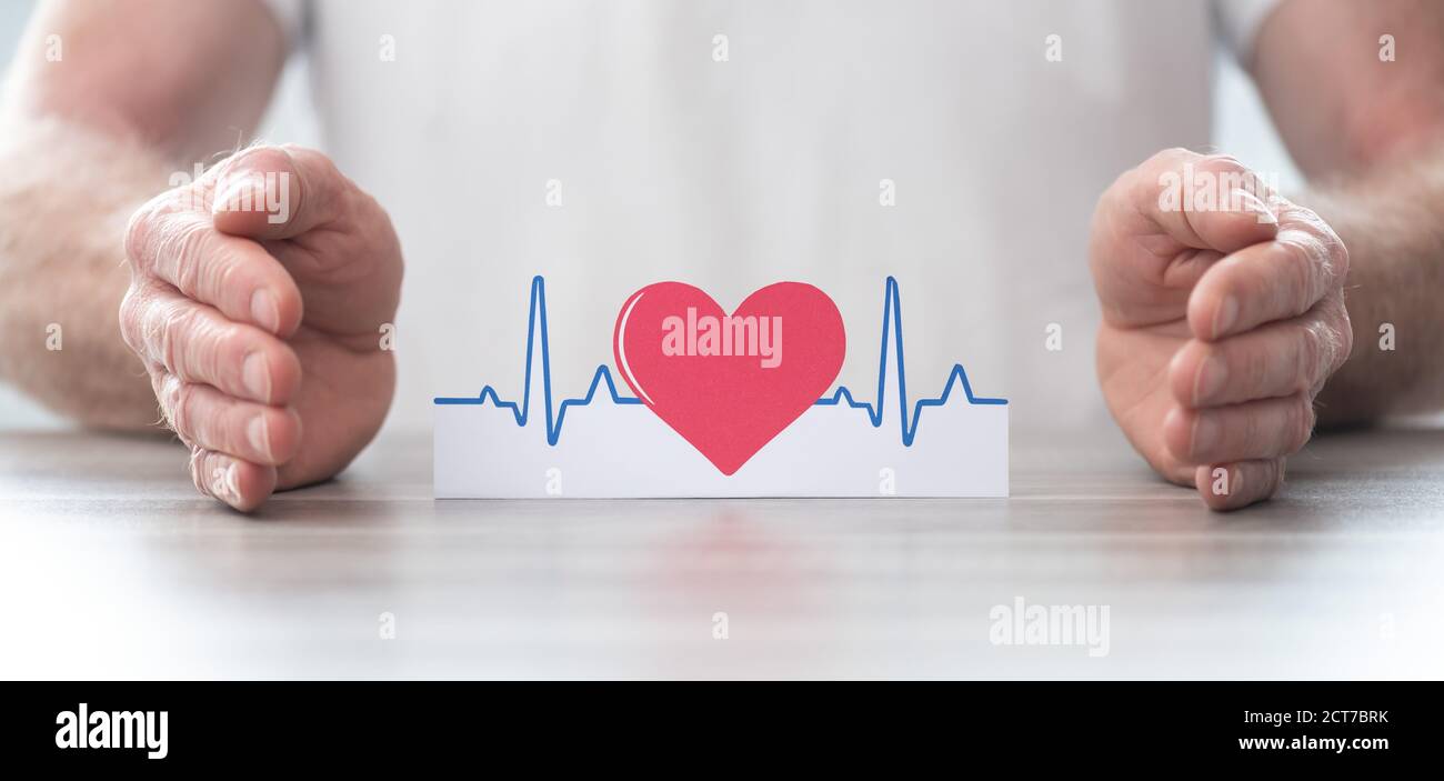 Heartbeat symbol protected by hands - Concept of health insurance Stock ...