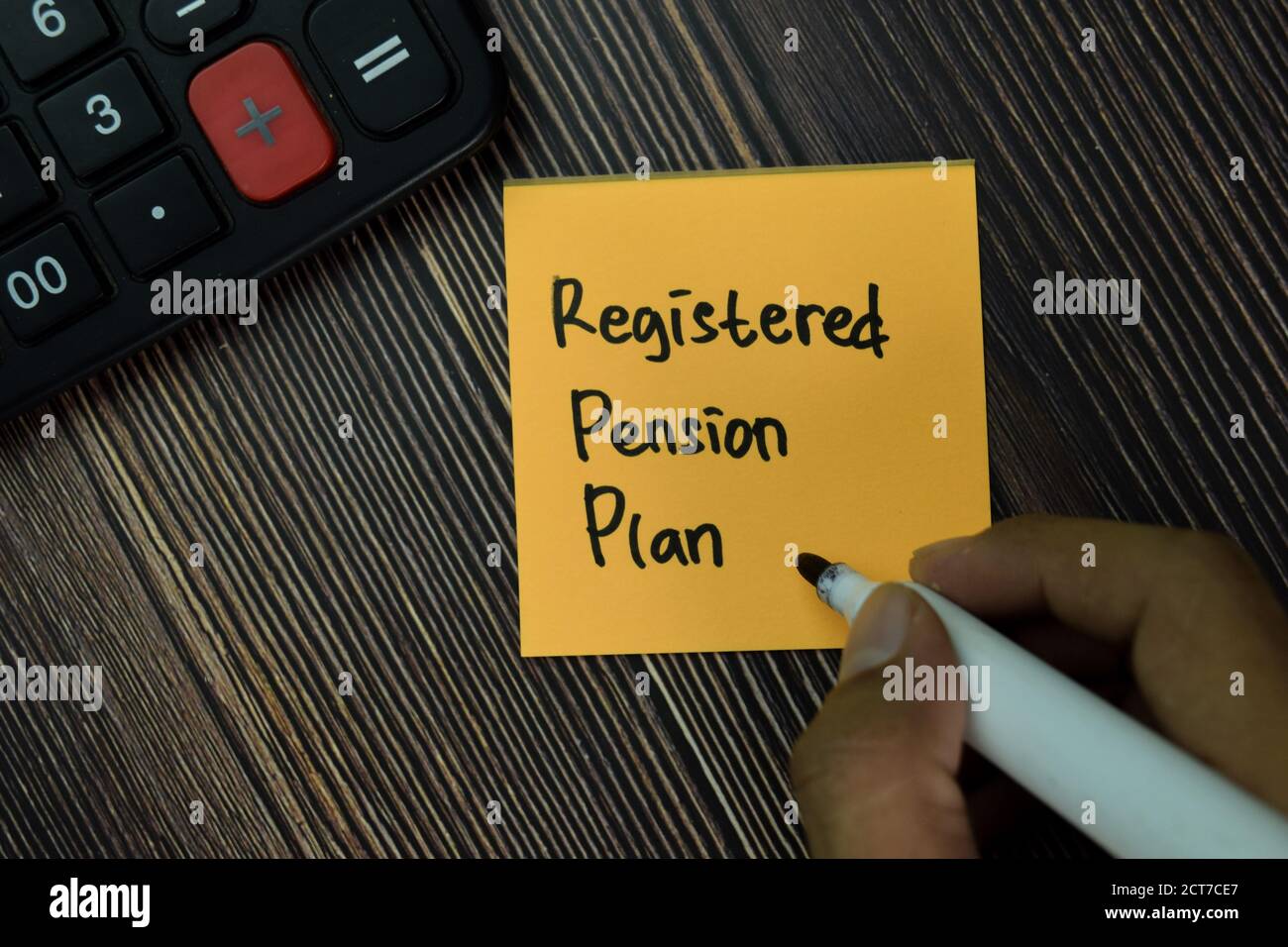 Registered Pension Plan write on sticky notes isolated on office desk