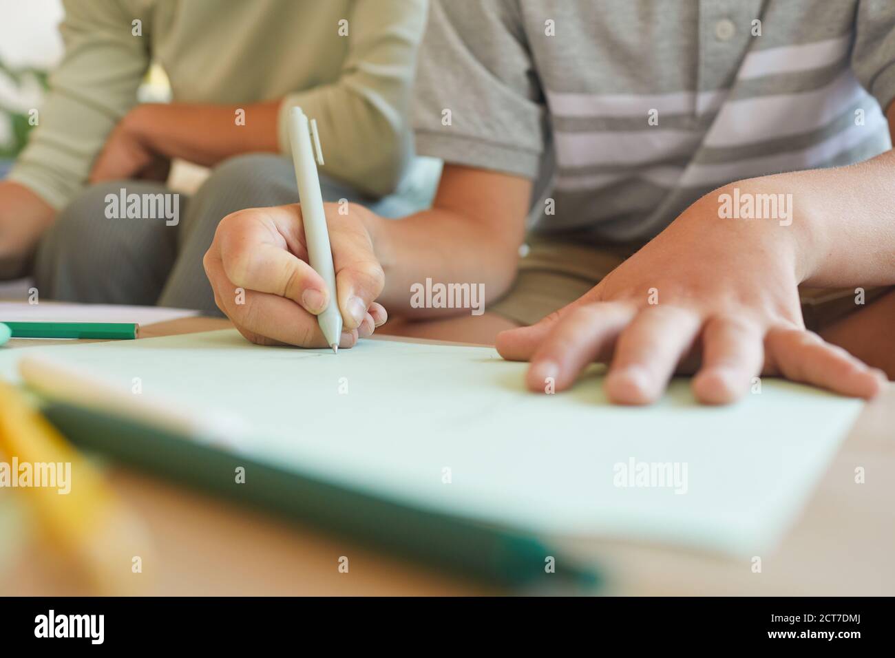Child holding up drawing hi-res stock photography and images - Alamy