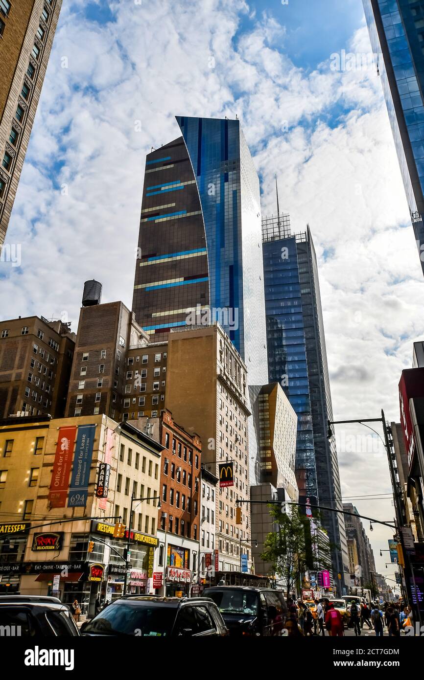 A city street filled with traffic surrounded by tall buildings in New ...