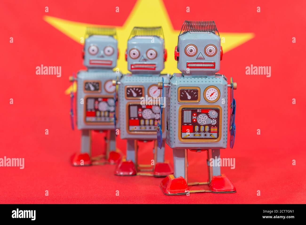 Windup clockwork toy robot on Chinese flag b/gd. For Chinese bots