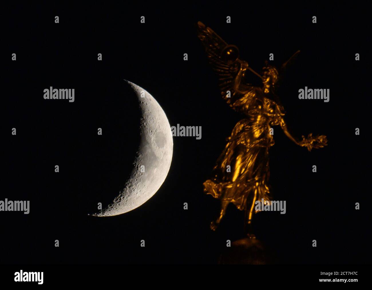 Angel with crescent moon hi-res stock photography and images
