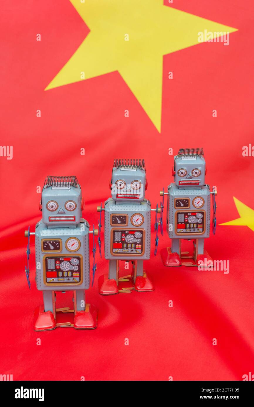 Wind-up clockwork toy robot on Chinese flag b/gd. For Chinese bots  influencing US 2020 election, China election meddling US, China trolls, AI,  bionics Stock Photo - Alamy