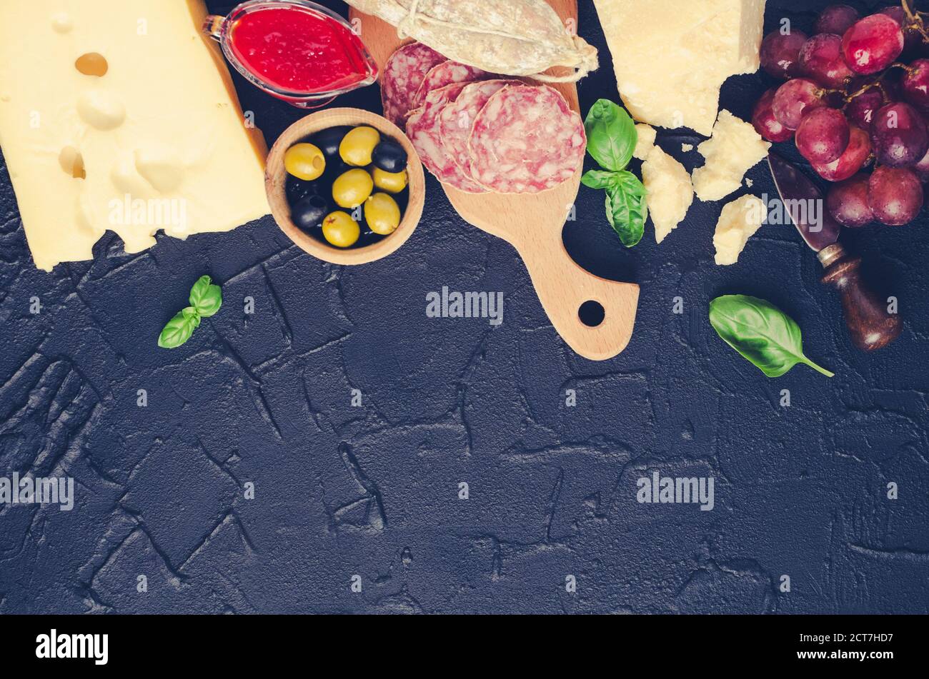 Table full of mediterranean appetizers, tapas or antipasti. Assorted ...