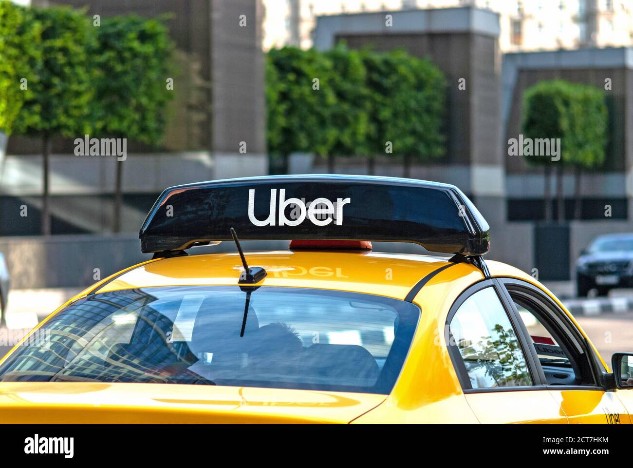 yellow taxi cab on the street with Uber logo icon on top - Moscow, 09//09/2020 Stock Photo